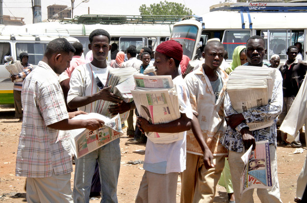 Sudanese newspaper venders at a bus station in Khartoum, Sudan, Wednesday, May 30, 2007.